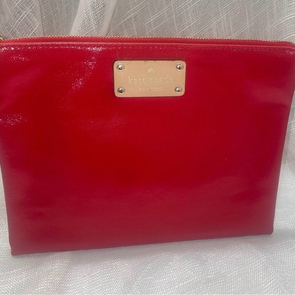 kate spade Handbags - kate spade Red Patent Wristlet Clutch with Gold Logo Plaque